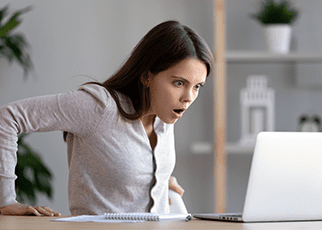surprised women looking at laptop screen